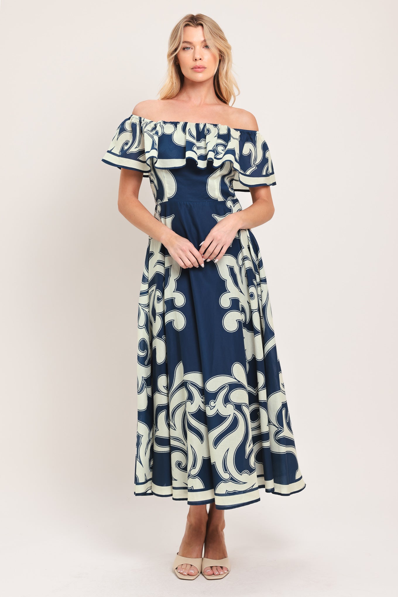 Woman wearing a blue and white patterned off the shoulder midi dress | Flying Tomato