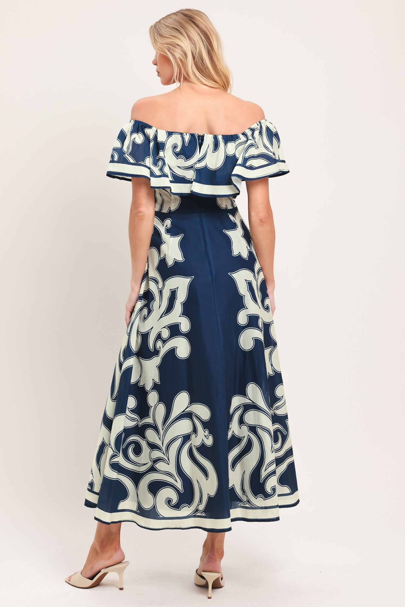 Woman wearing a blue and white patterned off the shoulder midi dress | Flying Tomato