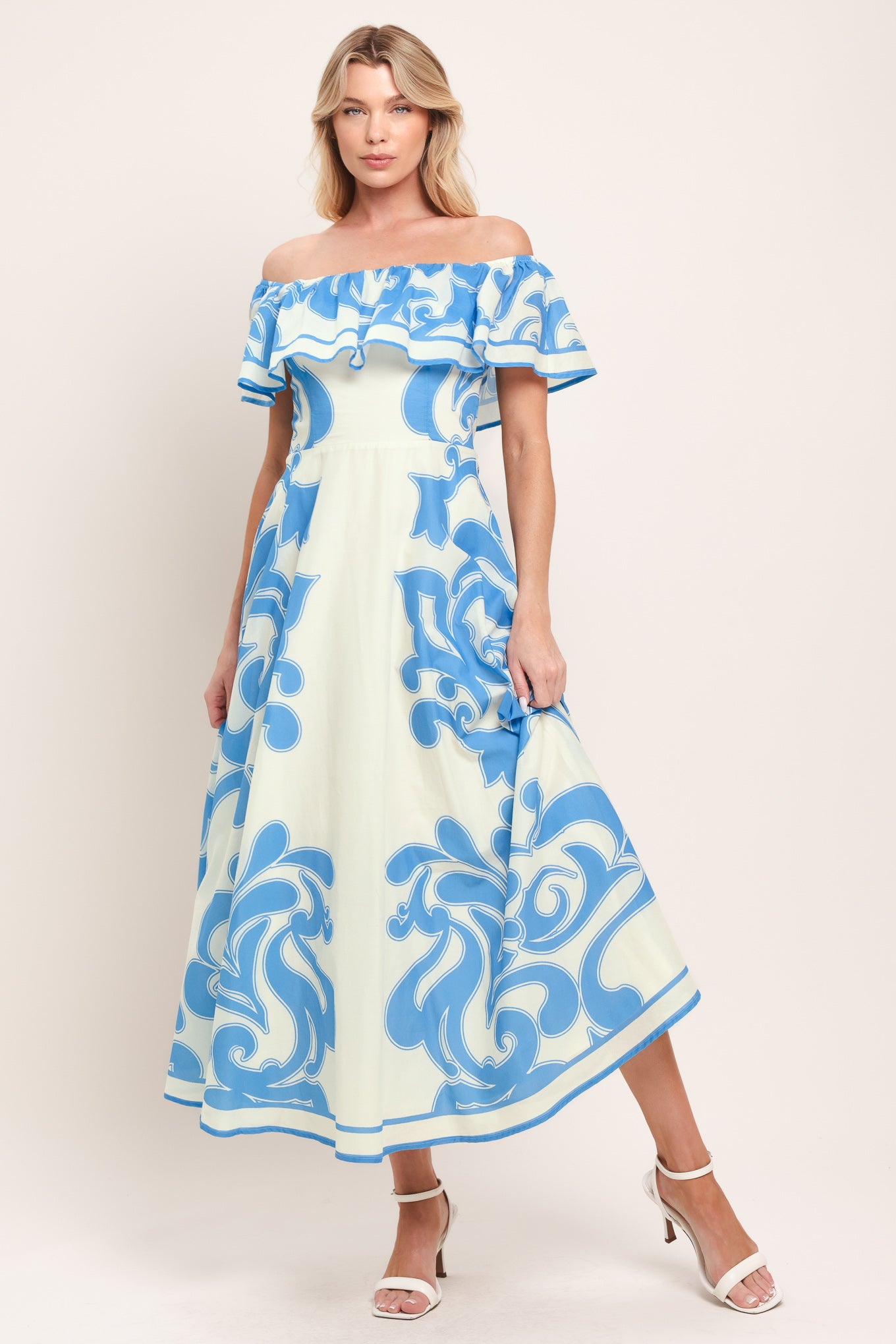 Woman wearing a blue and white patterned off the shoulder midi dress | Flying Tomato
