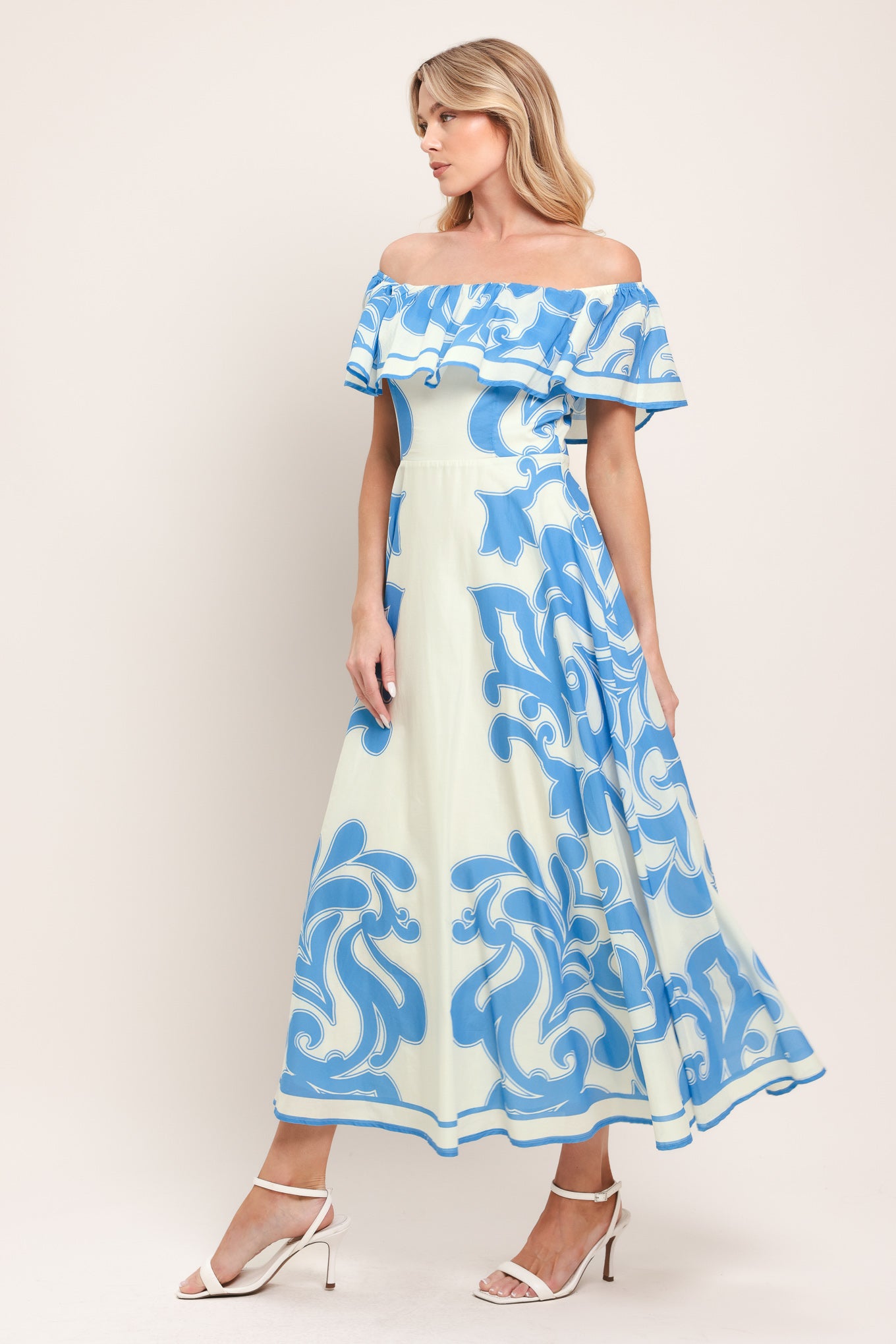 Woman wearing a blue and white patterned off the shoulder midi dress | Flying Tomato