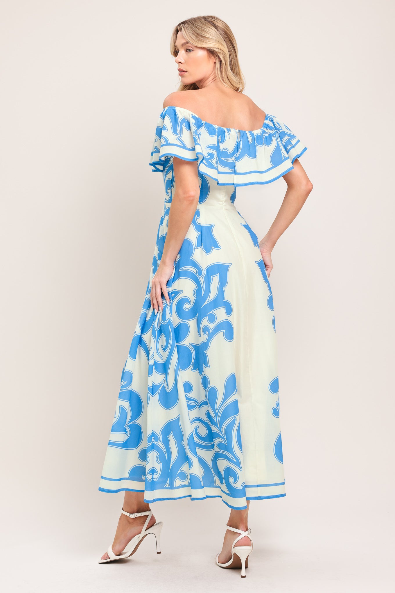 Woman wearing a blue and white patterned off the shoulder midi dress | Flying Tomato