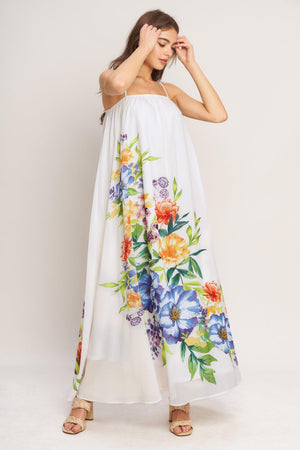 A printed woven ankle dress featuring straight neckline with straps and low back with tie