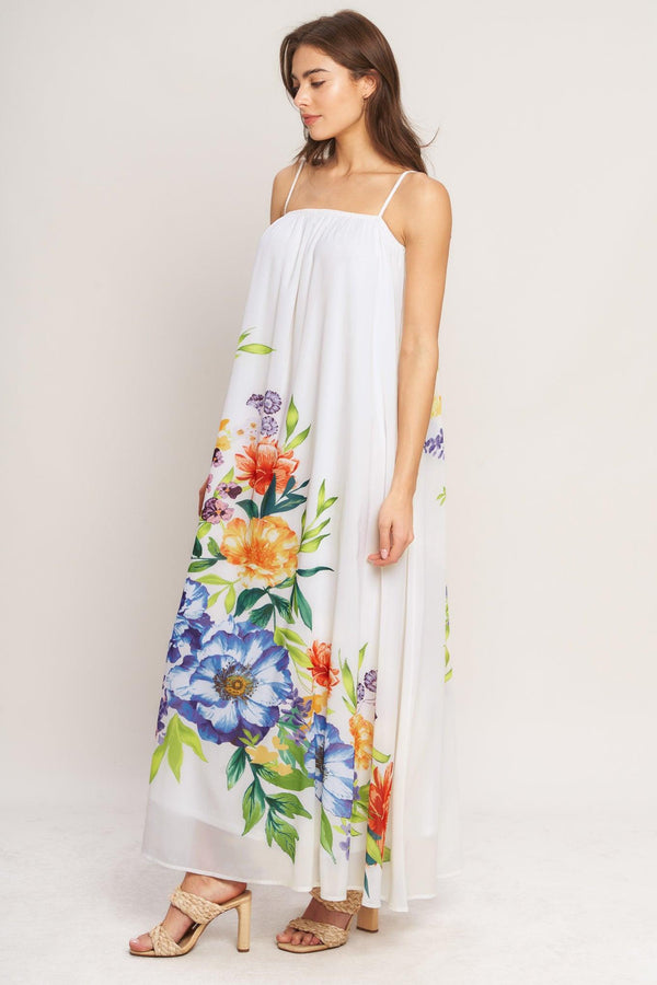 A printed woven ankle dress featuring straight neckline with straps and low back with tie