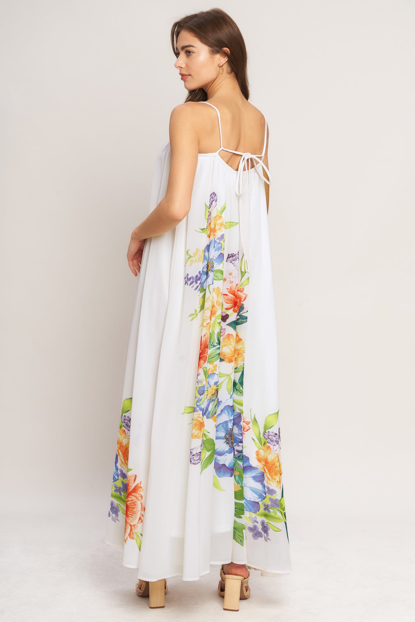 A printed woven ankle dress featuring straight neckline with straps and low back with tie