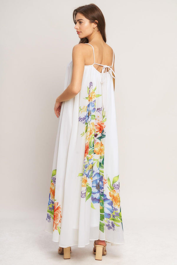 A printed woven ankle dress featuring straight neckline with straps and low back with tie