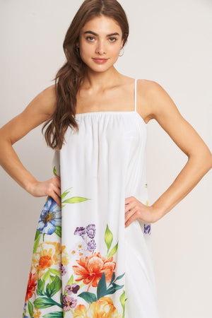 A printed woven ankle dress featuring straight neckline with straps and low back with tie