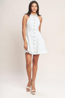 White sleeveless mini dress with a collared neckline, fitted bodice, and gold button front

Details:

Self: 97% Cotton 3% Spandex

Size & Fit

- Model is 5`8" And Wearing Size Small
- Measurements Taken From Size Small
- Approx. Length: 35"