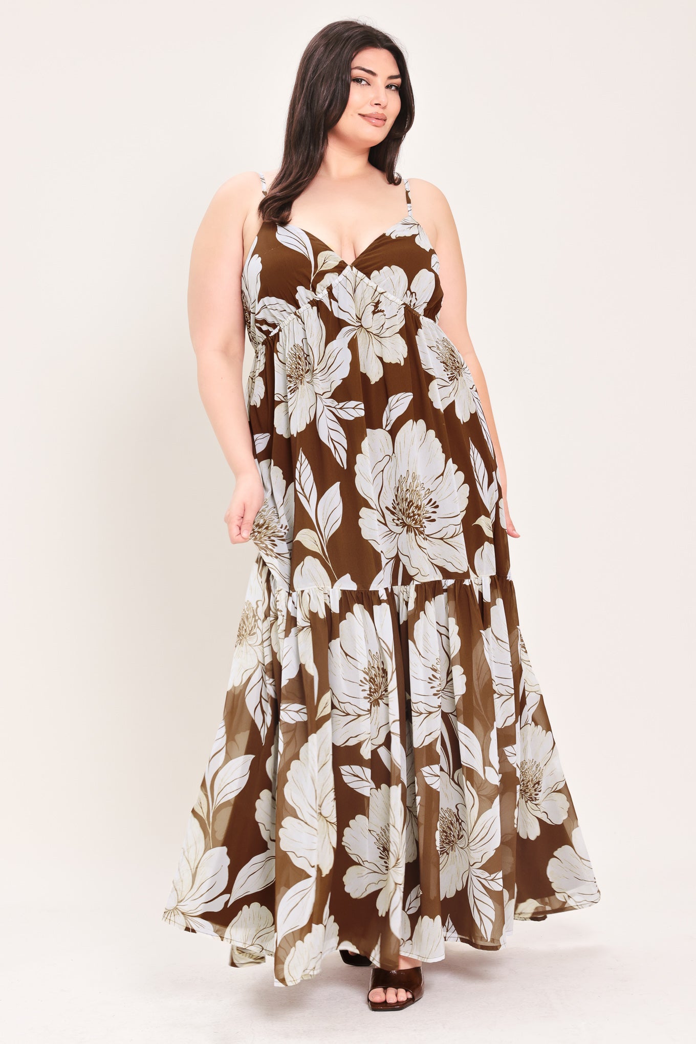 Woman wearing a brown with beige flowers maxi dress with single tier and smocked back bodice | Flying Tomato