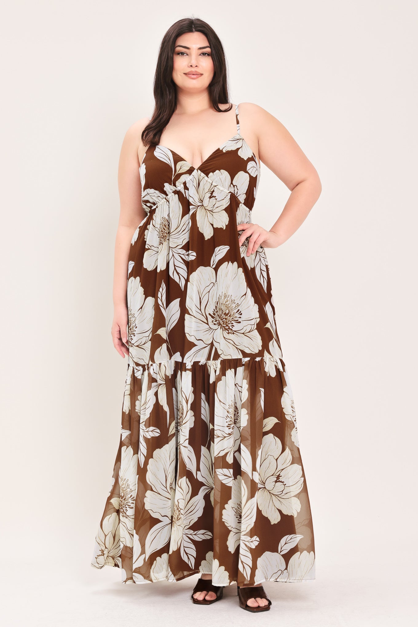 Woman wearing a brown with beige flowers maxi dress with single tier and smocked back bodice | Flying Tomato