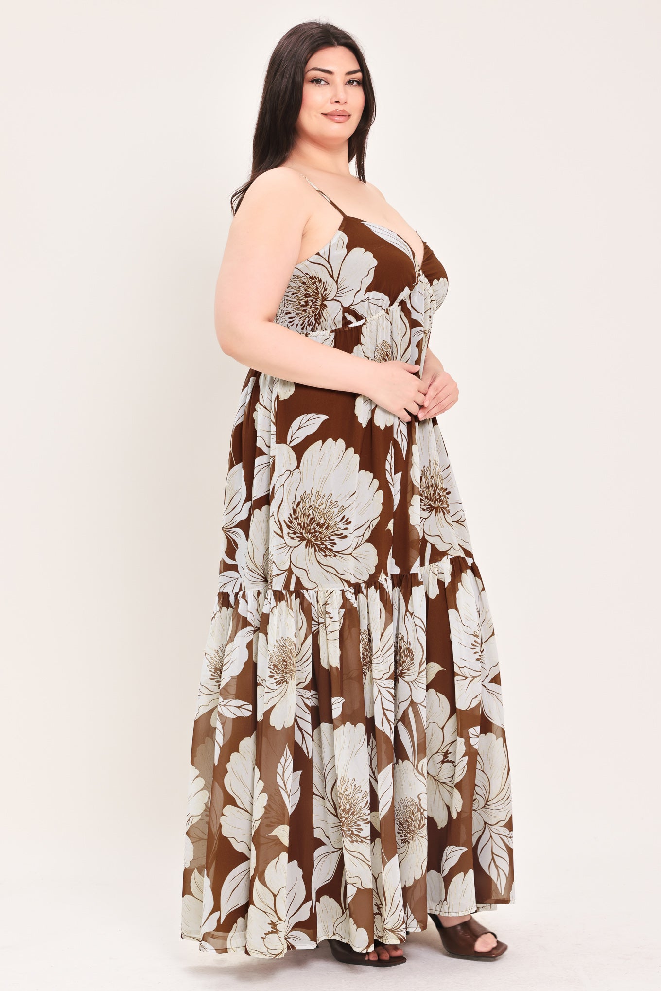 Woman wearing a brown with beige flowers maxi dress with single tier and smocked back bodice | Flying Tomato