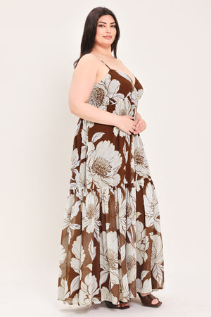 Woman wearing a brown with beige flowers maxi dress with single tier and smocked back bodice | Flying Tomato