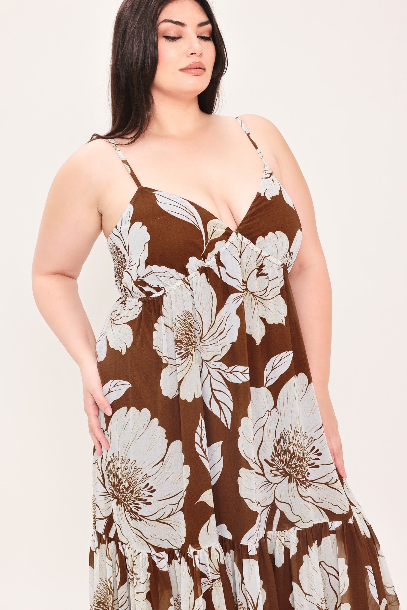 Woman wearing a brown with beige flowers maxi dress with single tier and smocked back bodice | Flying Tomato