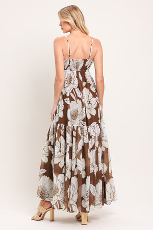 Woman wearing a brown with beige flowers maxi dress with single tier and smocked back bodice | Flying Tomato
