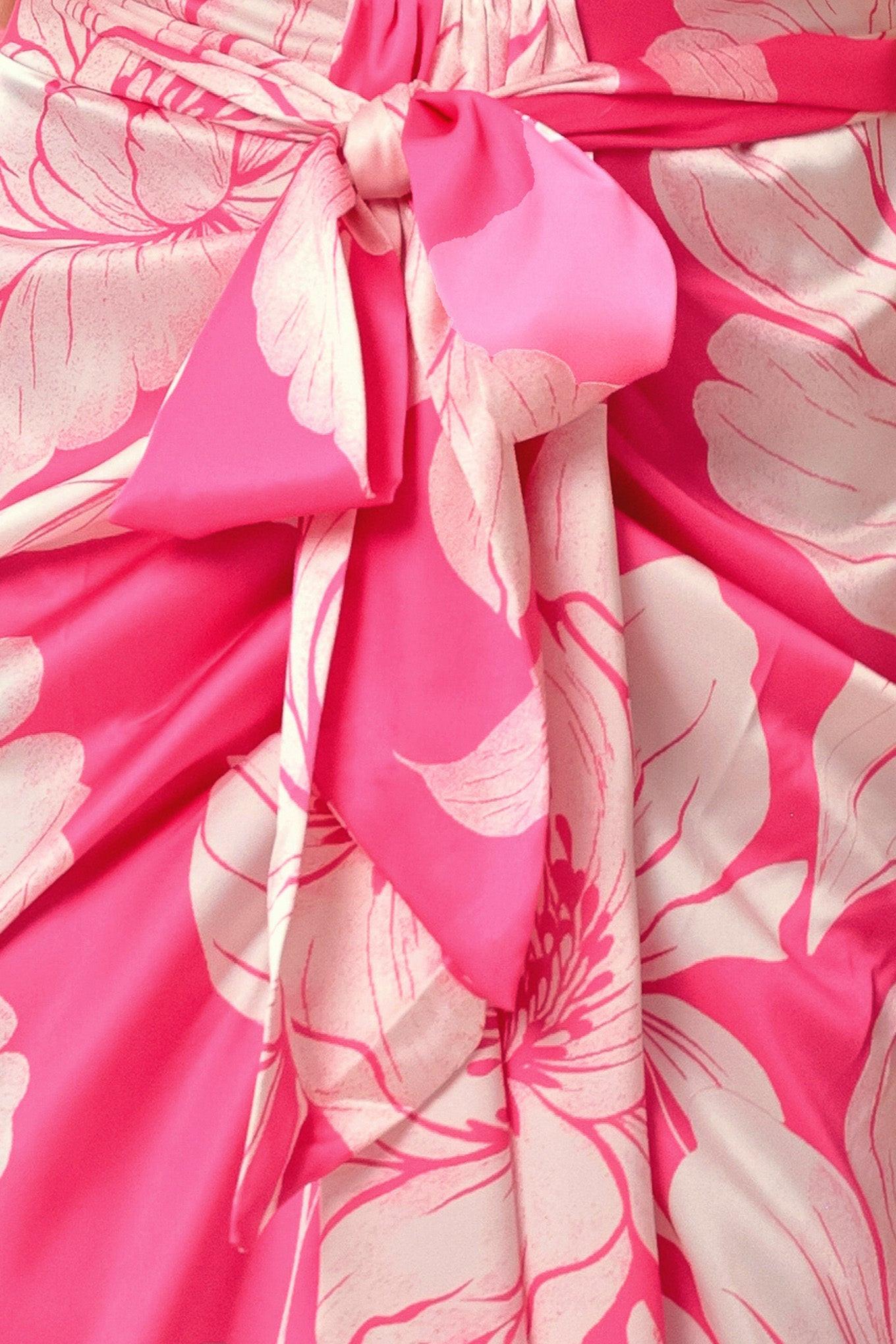 Close-up of a pink fabric with white floral patterns