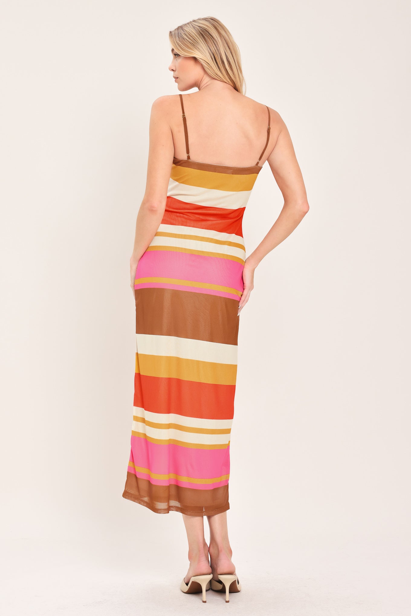 Woman wearing a colorful striped power mesh midi dress | Flying Tomato