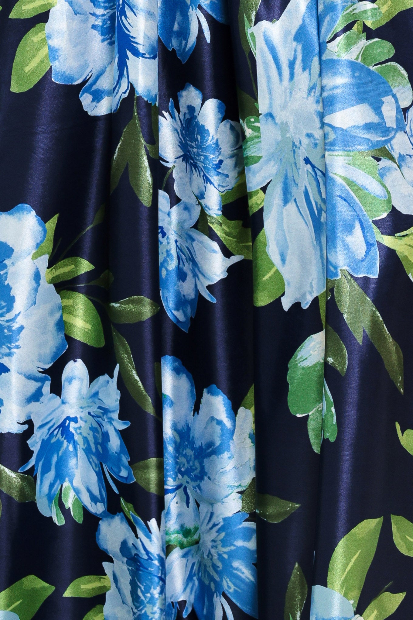 Close up of a navy blue with lighter blue flowers printed maxi dress with straight neckline, straps and self sash tie | Flying Tomato