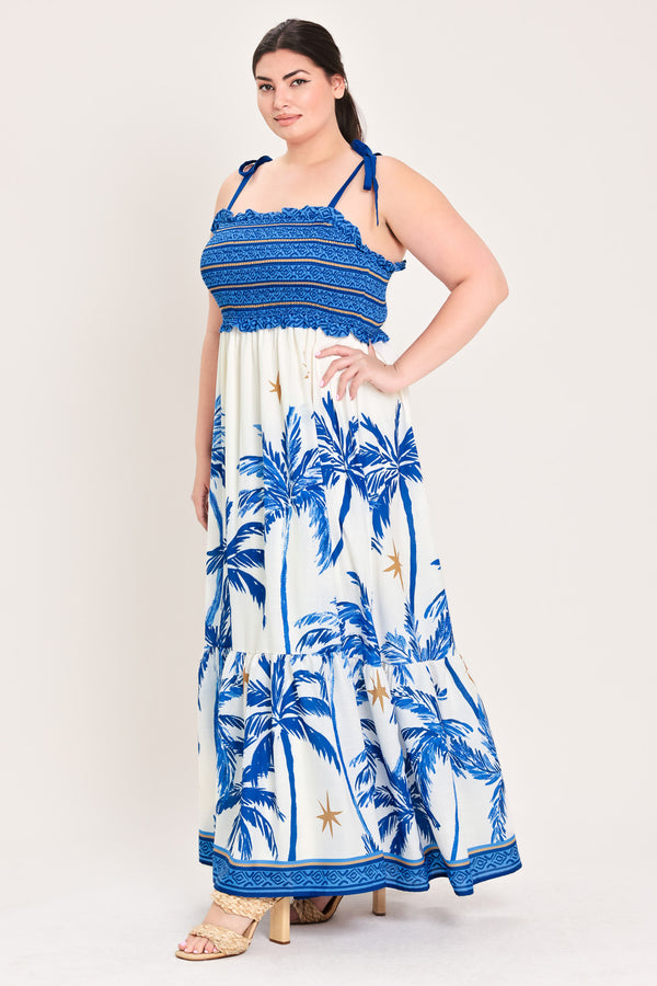 Woman wearing a blue and white dress with palm tree pattern | Flying Tomato Curve