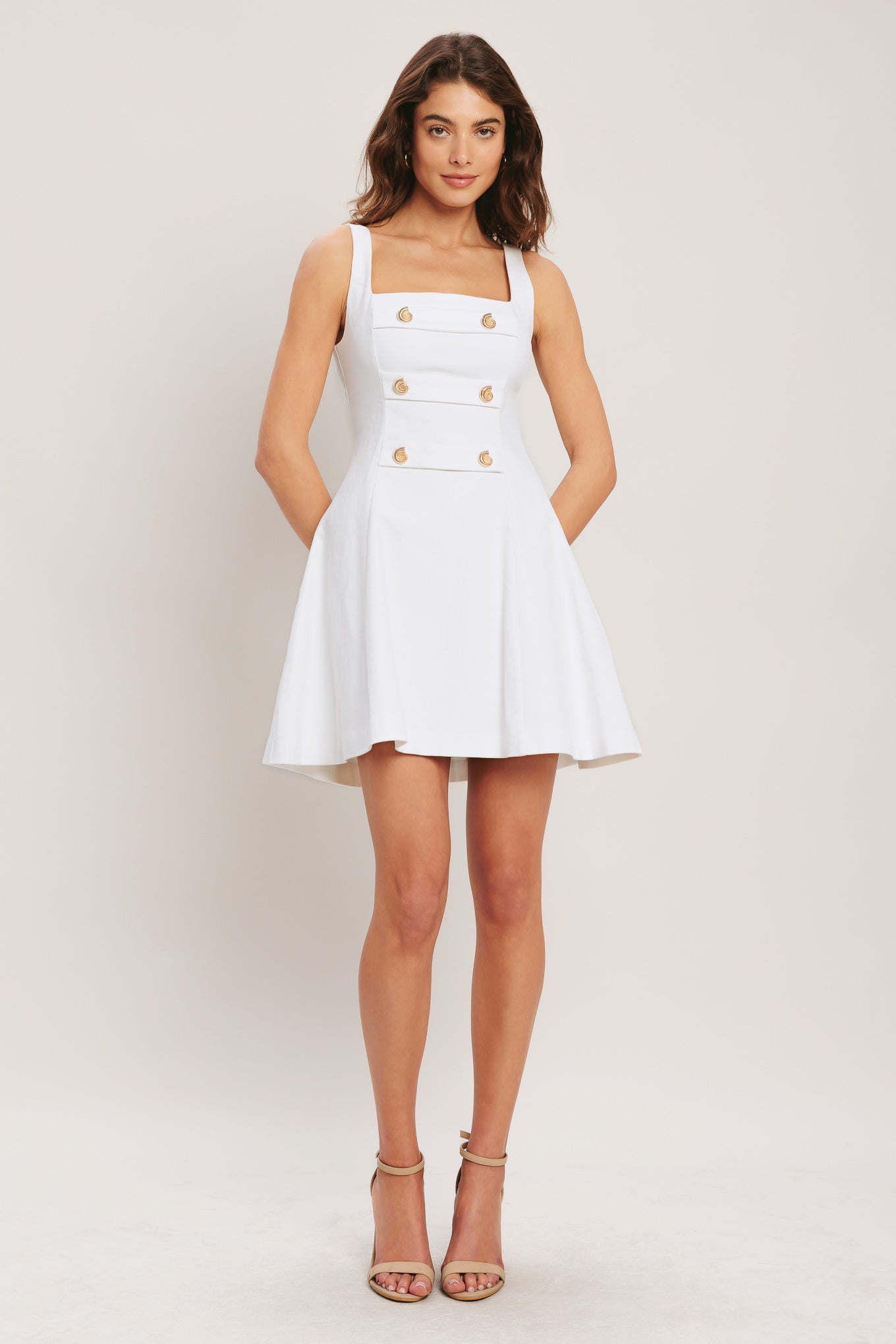 
A solid woven mini dress featuring square neckline, sleeveless, front button detail, circle skirt and back zipper closure

Details:

Self : 97% Cotton 3% Spandex

Size &amp; Fit

- Model is 5`8" And Wearing Size Small
- Measurements Taken From Size Small
- Approx. Length: 34"