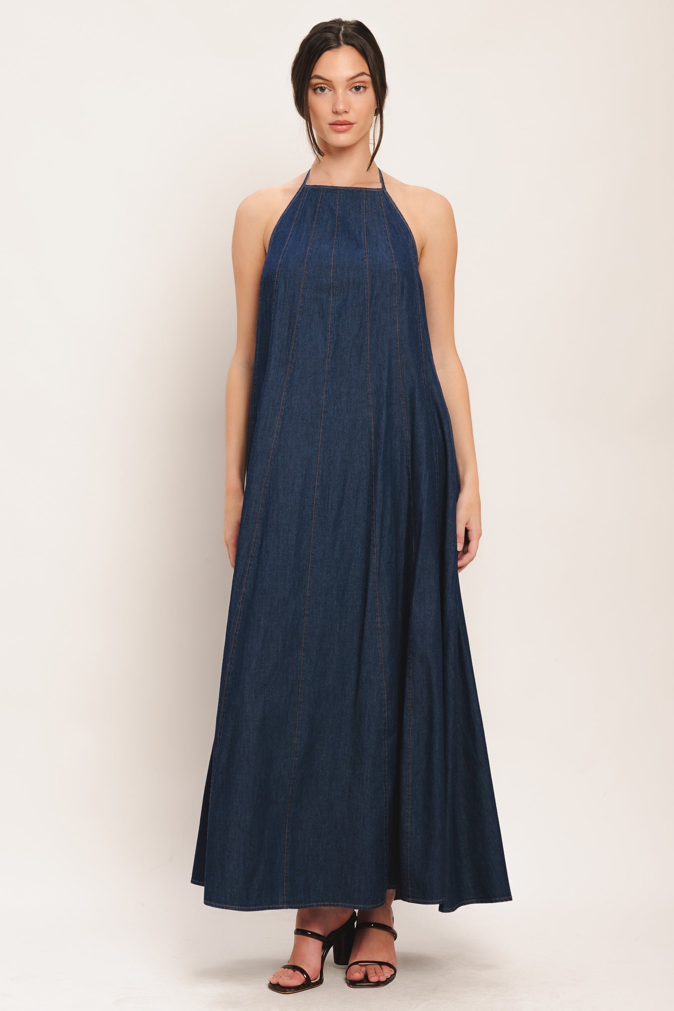 A solid denim midi dress featuring bib neckline and back neck tie and low back

Details:

Self: 100% Cotton

Size & Fit

-Model is 5`8" And Wearing Size Small
-Measurements Taken From Size Small
-Approx. Length: 53"