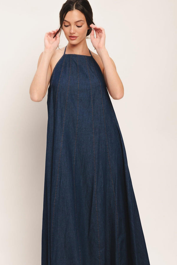 A solid denim midi dress featuring bib neckline and back neck tie and low back

Details:

Self: 100% Cotton

Size & Fit

-Model is 5`8" And Wearing Size Small
-Measurements Taken From Size Small
-Approx. Length: 53"
