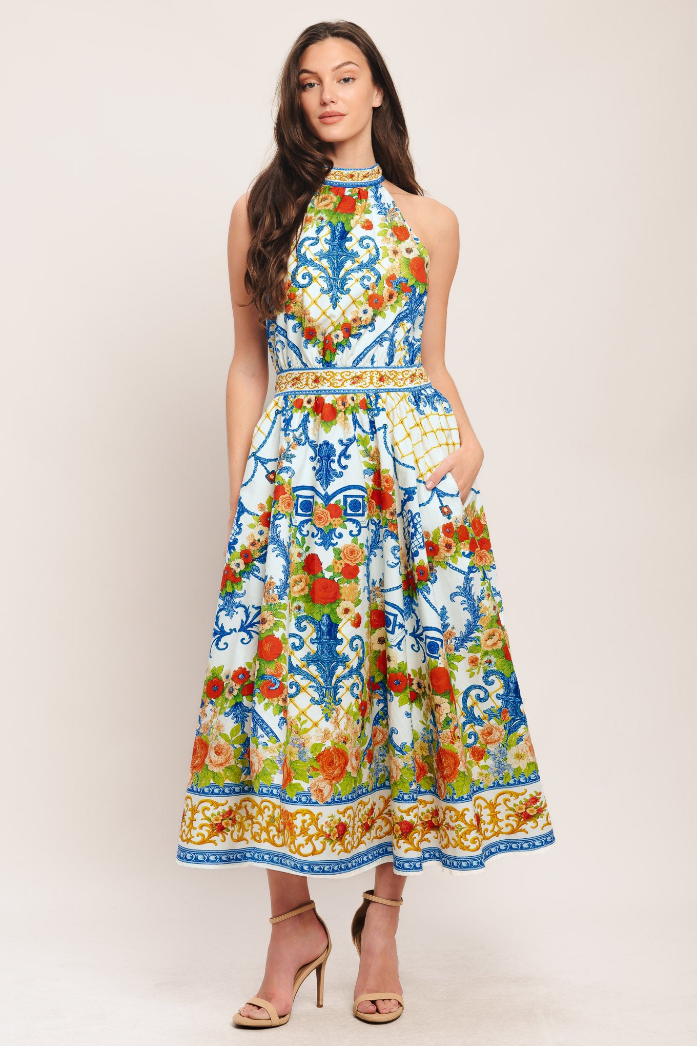 A printed woven midi dress featuring halter neckline, full skirt, back neck tie and smocked back waistband

Details:

Self: 100% Cotton

Lining: 100% Polyester

Size & Fit

-Model is 5`8" And Wearing Size Small
-Measurements Taken From Size Small
-Approx. Length: 53"