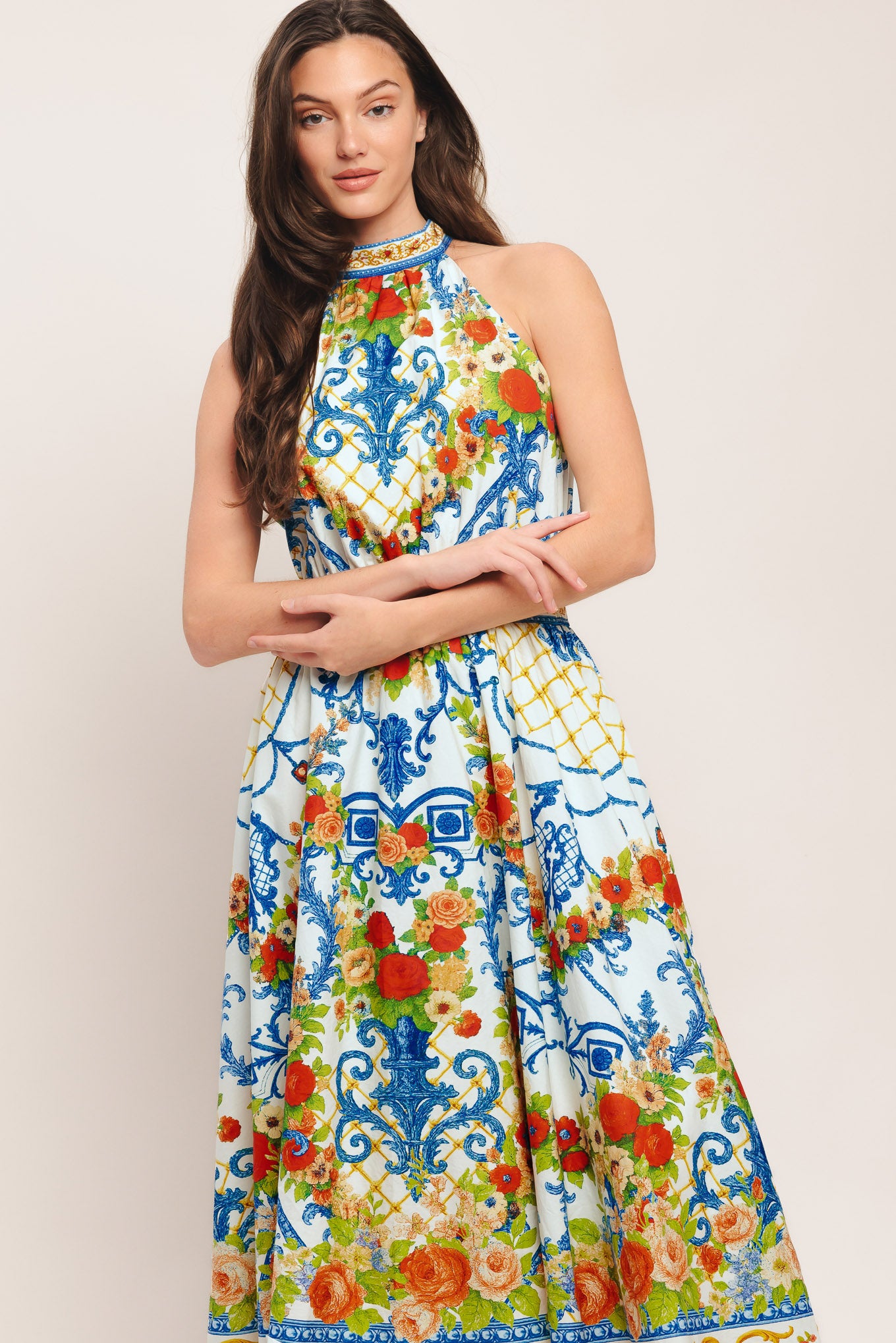 A printed woven midi dress featuring halter neckline, full skirt, back neck tie and smocked back waistband

Details:

Self: 100% Cotton

Lining: 100% Polyester

Size & Fit

-Model is 5`8" And Wearing Size Small
-Measurements Taken From Size Small
-Approx. Length: 53"