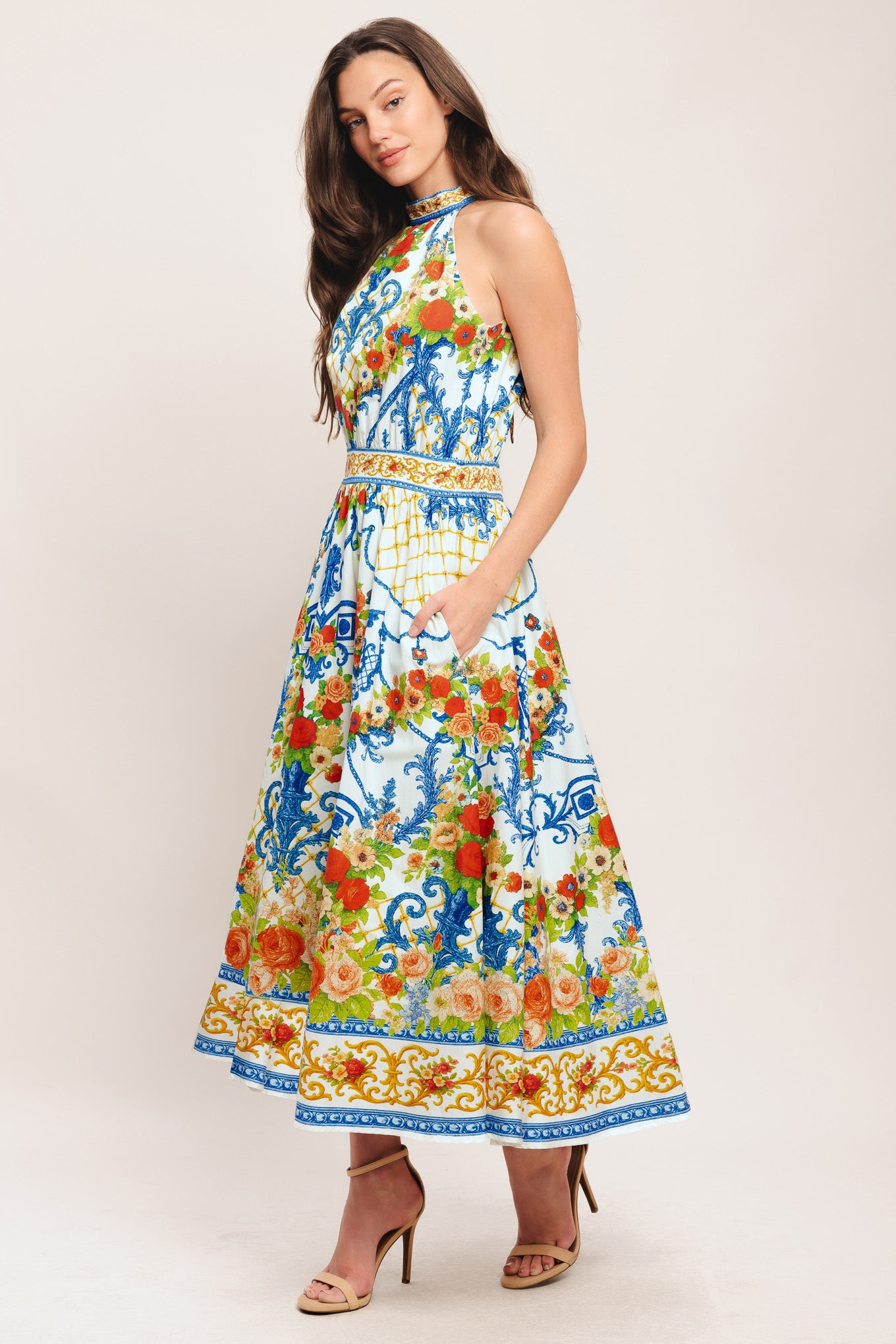 A printed woven midi dress featuring halter neckline, full skirt, back neck tie and smocked back waistband

Details:

Self: 100% Cotton

Lining: 100% Polyester

Size & Fit

-Model is 5`8" And Wearing Size Small
-Measurements Taken From Size Small
-Approx. Length: 53"