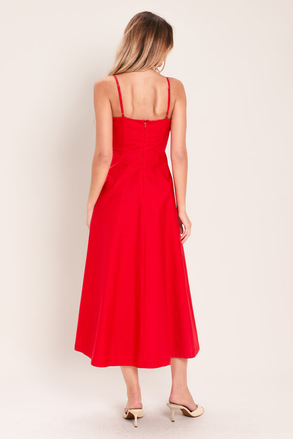 Woman wearing a red midi dress featuring straight neckline, straps, pleated waistband, circle skirt and back zipper closure | Flying Tomato
