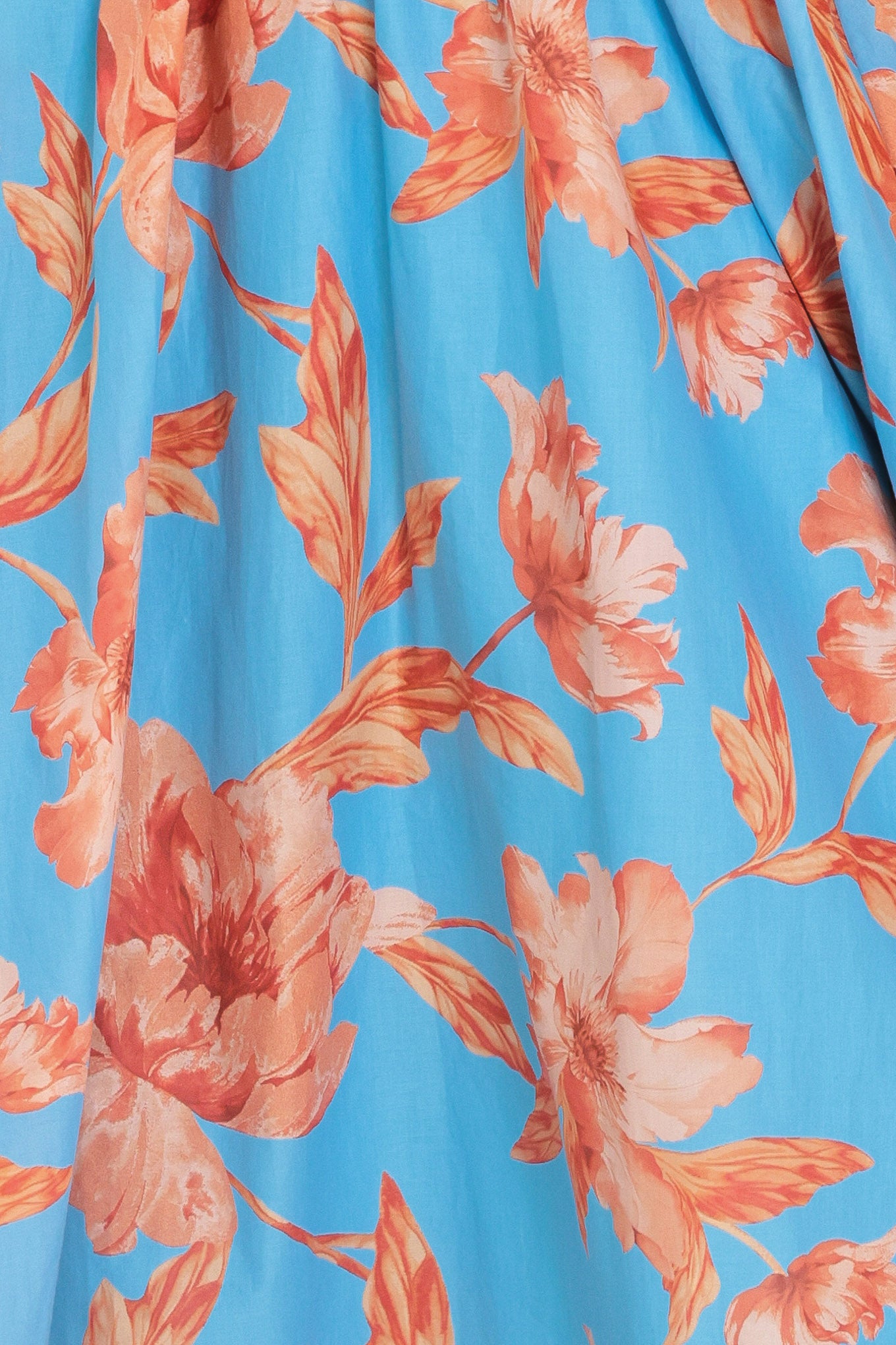 Woman wearing a blue with peach floral  pattern midi dress featuring twisted bodice with cut out, straps, full skirt and smocked back bodice | Flying Tomato