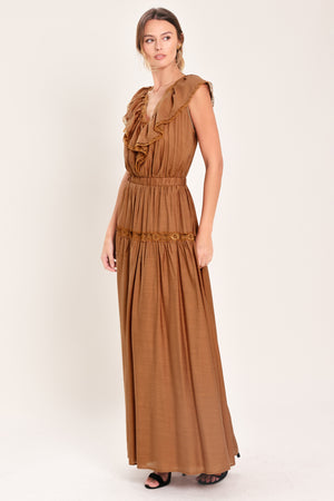 Woman wearing a brown maxi dress featuring V neckline with ruffle and lace edge, elastic waist and back tie | Flying Tomato