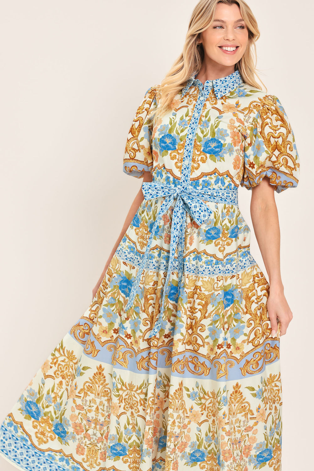 Woman wearing a patterned midi shirt dress with short sleeve and self sash tie | Flying Tomato
