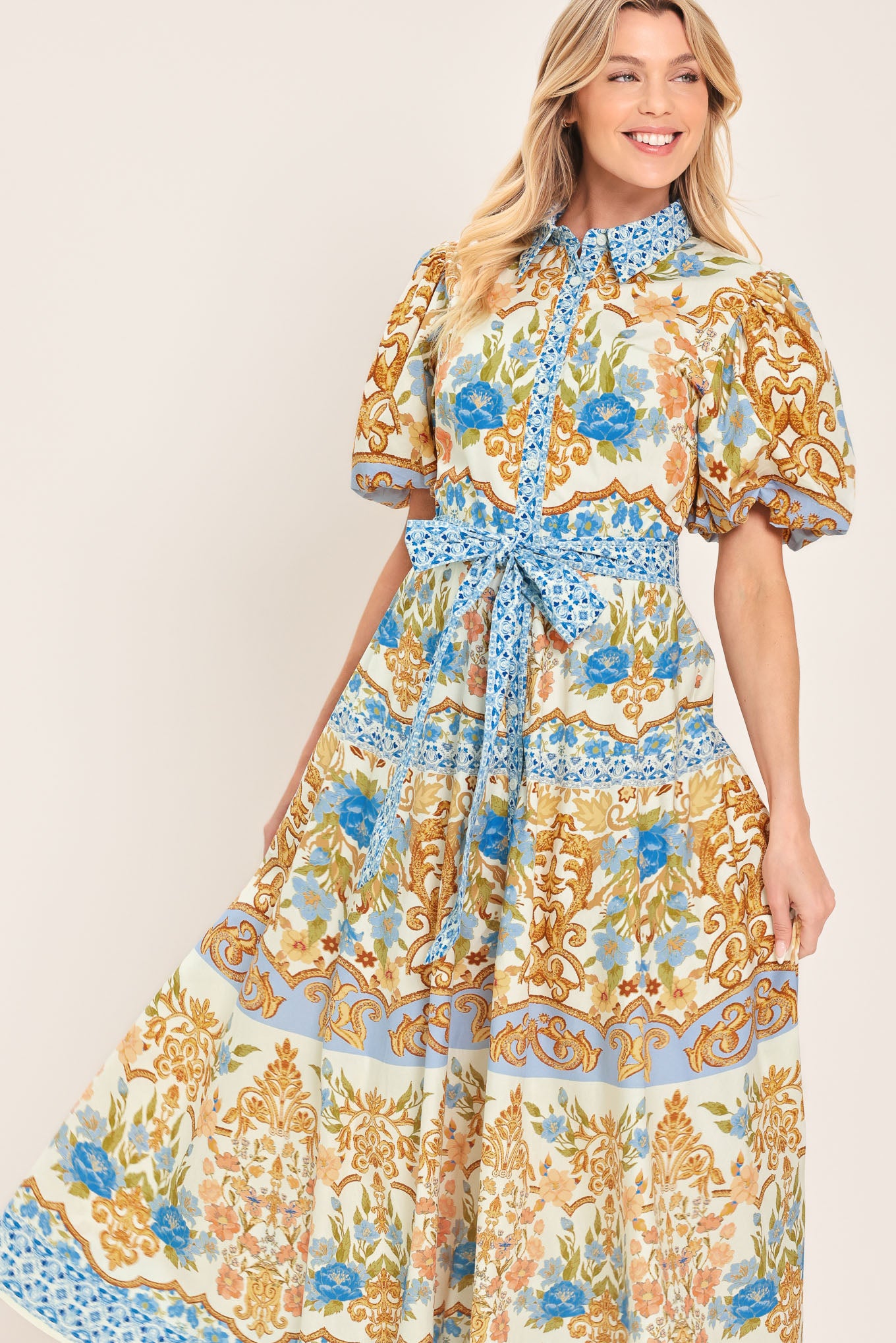 Woman wearing a patterned midi shirt dress with short sleeve and self sash tie | Flying Tomato