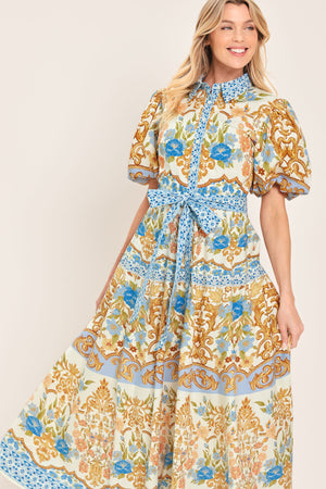 Woman wearing a patterned midi shirt dress with short sleeve and self sash tie | Flying Tomato