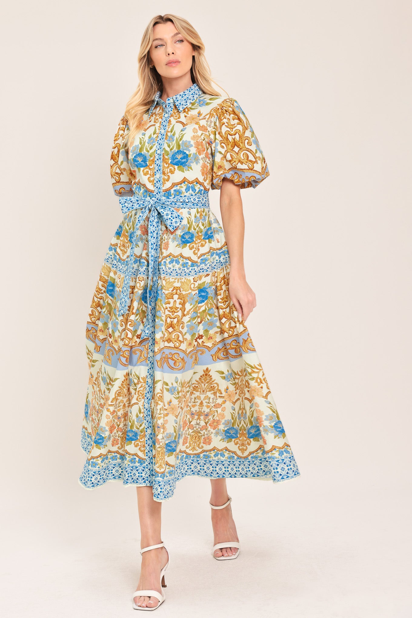 Woman wearing a patterned midi shirt dress with short sleeve and self sash tie | Flying Tomato