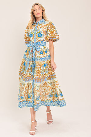 Woman wearing a patterned midi shirt dress with short sleeve and self sash tie | Flying Tomato