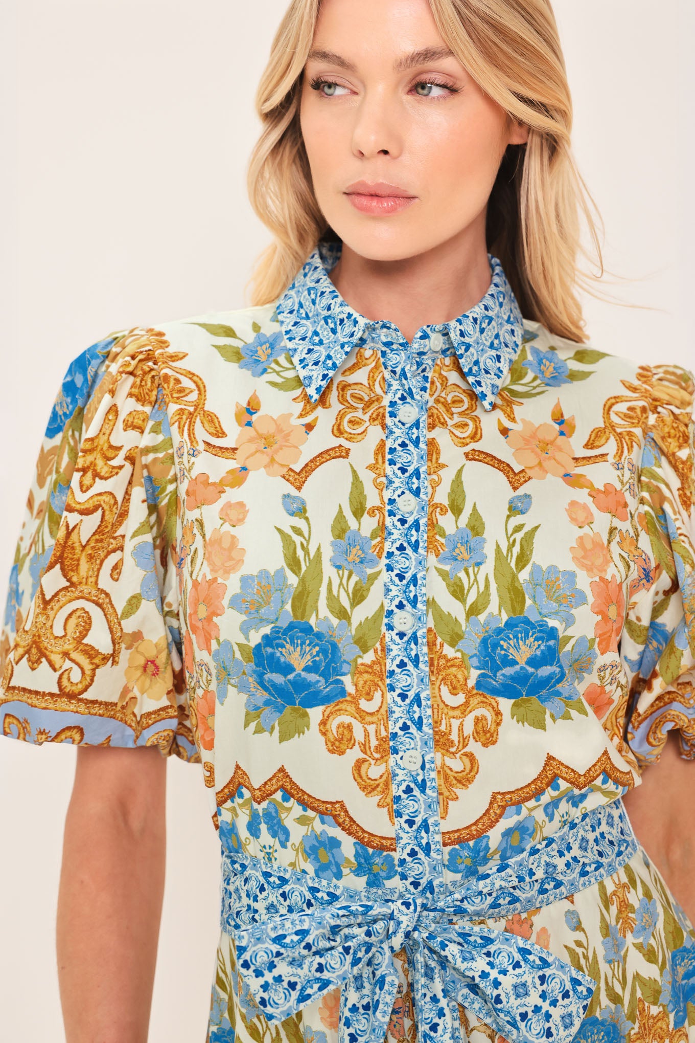 Woman wearing a patterned midi shirt dress with short sleeve and self sash tie | Flying Tomato