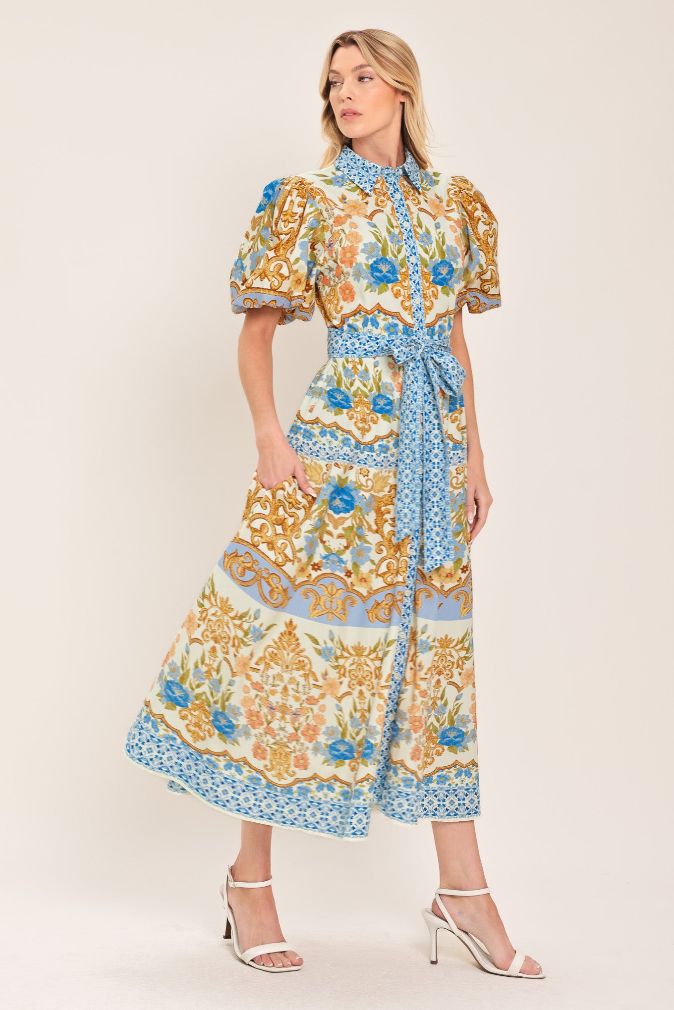 Woman wearing a patterned midi shirt dress with short sleeve and self sash tie | Flying Tomato