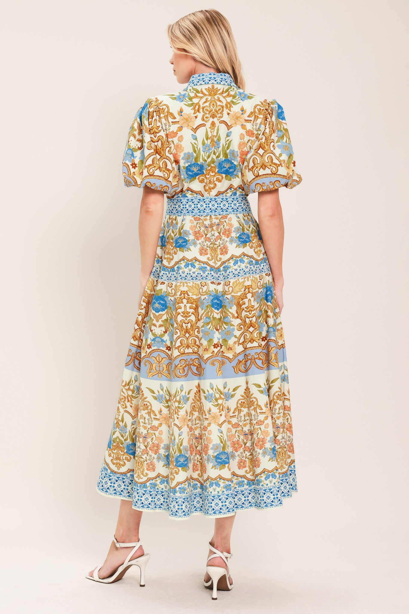 Woman wearing a patterned midi shirt dress with short sleeve and self sash tie | Flying Tomato