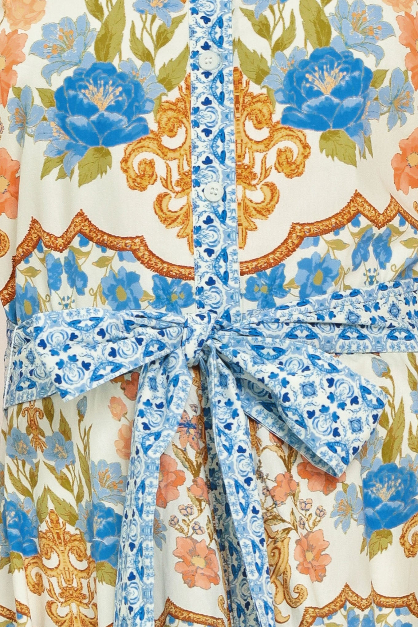 Woman wearing a patterned midi shirt dress with short sleeve and self sash tie | Flying Tomato