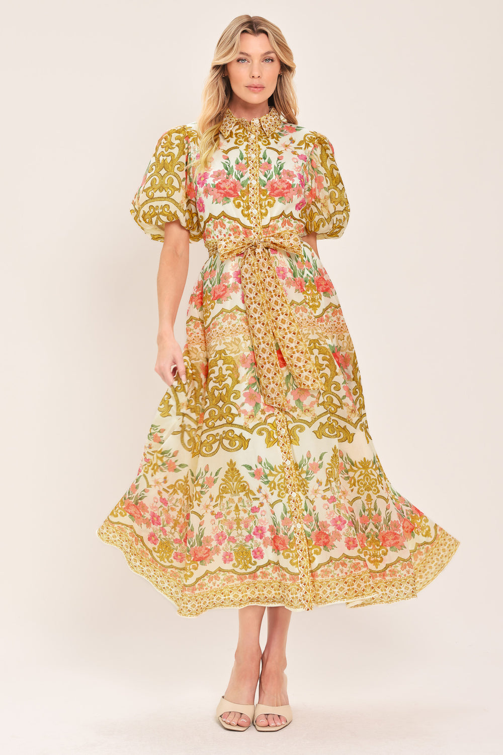 Woman wearing a floral and gold patterned midi shirt dress with short sleeve and self sash tie | Flying Tomato