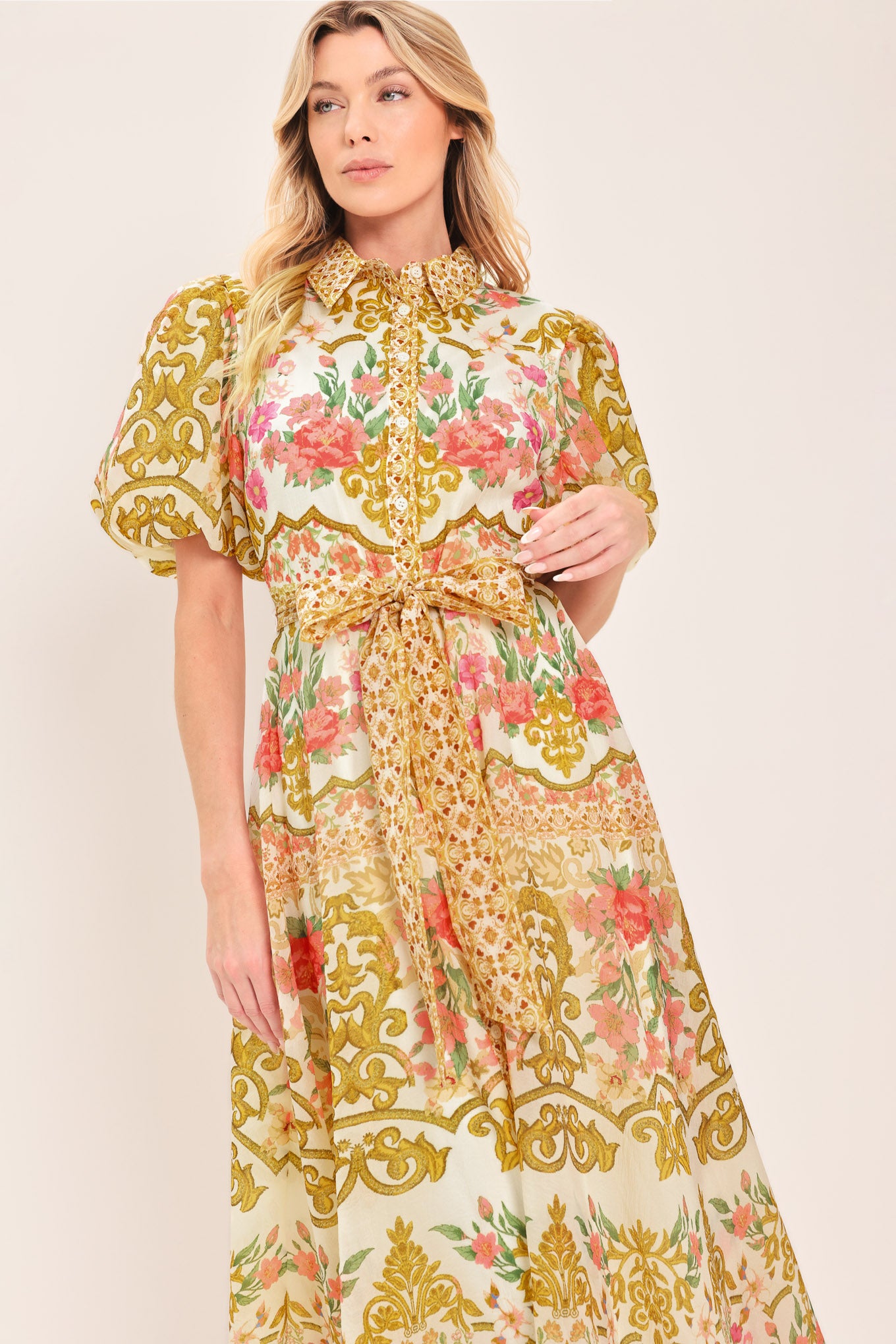 Woman wearing a floral and gold patterned midi shirt dress with short sleeve and self sash tie | Flying Tomato