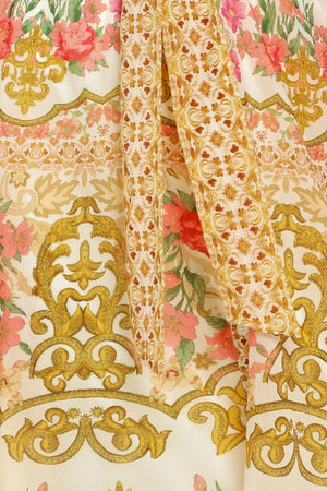 Close up of a floral and gold patterned midi shirt dress with short sleeve and self sash tie | Flying Tomato