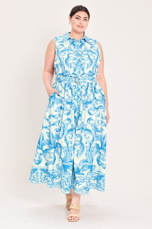 Woman wearing a blue and white patterned  maxi dress featuring collar, sleeveless, button down closure, self belt and full skirt  | Flying Tomato