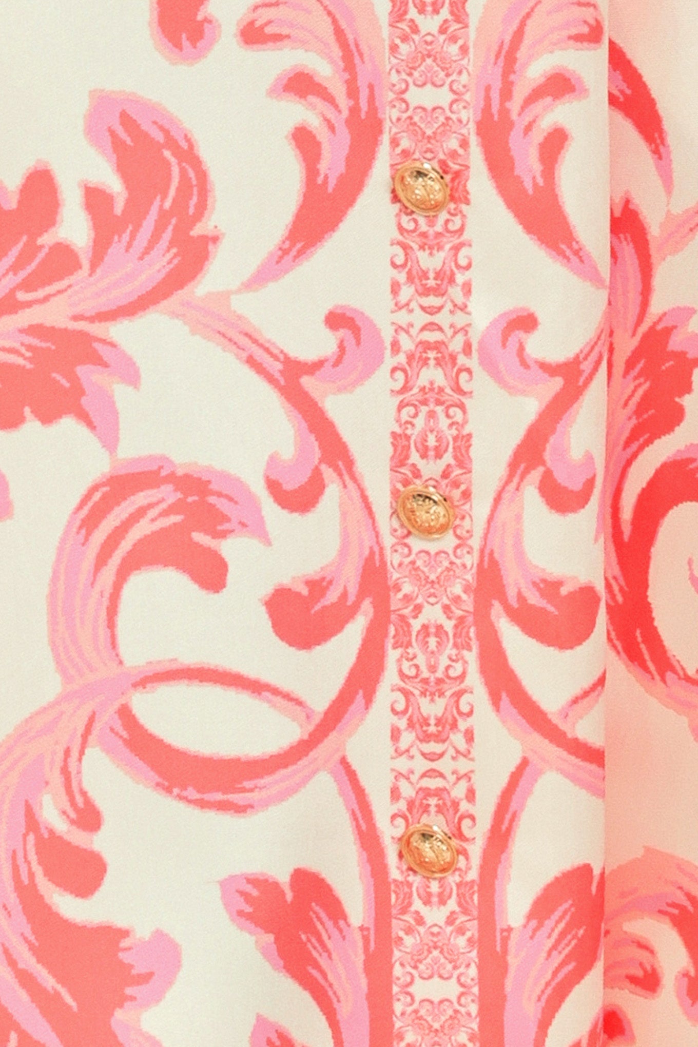 Close up of a strapless midi dress with pink and white floral pattern featuring button down detail, circle skirt and back zipper closure | Flying Tomato