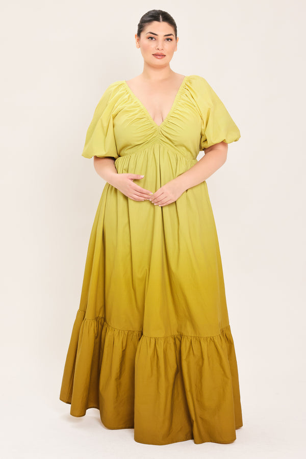 A woman modeling a yellow midi dress with puff sleeves, a deep V-neckline, and a gathered skirt with a tiered hem | Plus Curve Flying Tomato