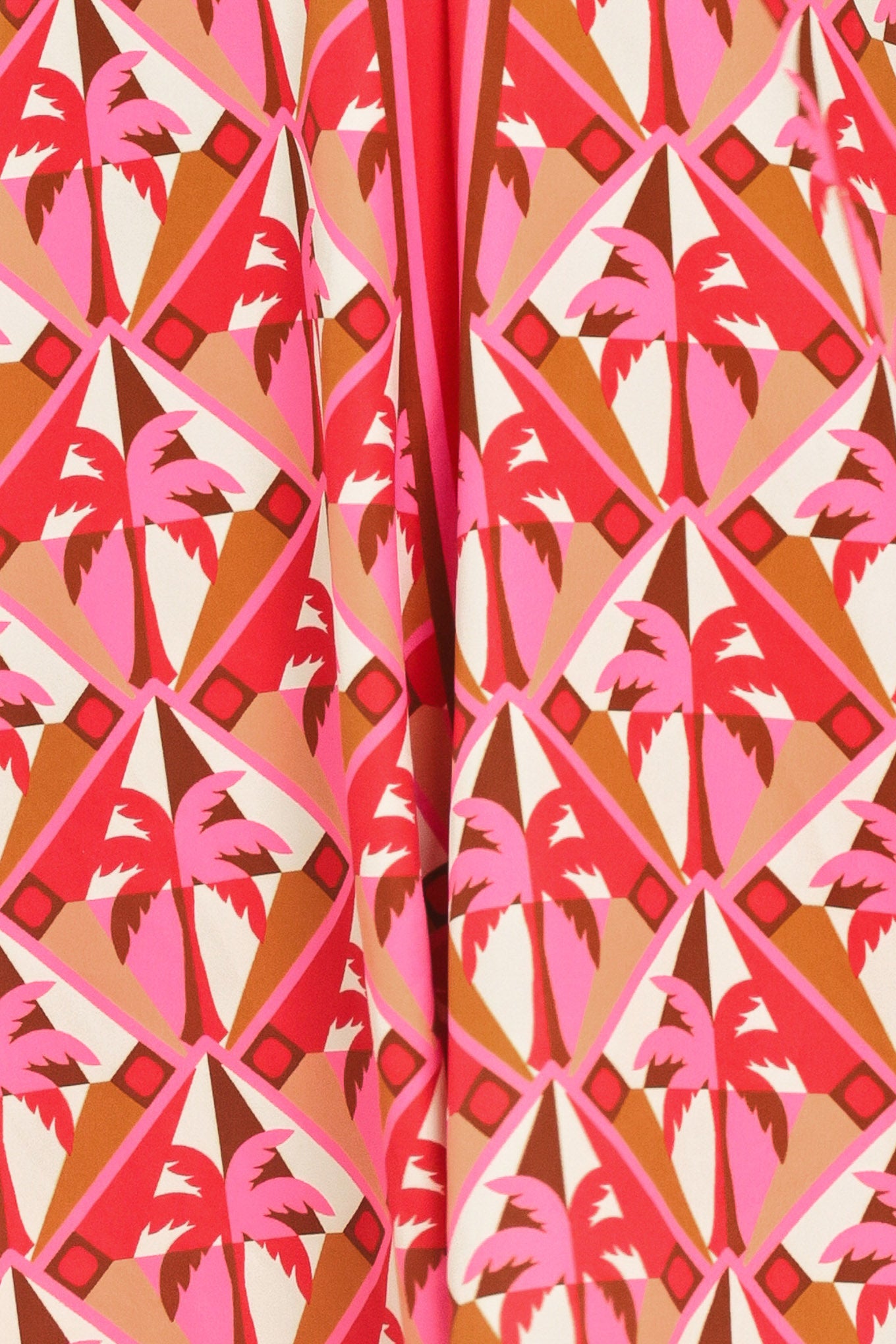 Patterned fabric with pink and orange geometric design | Flying Tomato