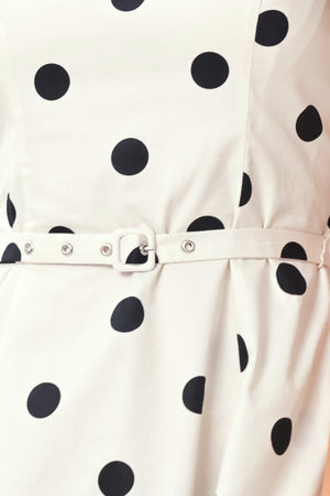 Close up of white dress with black polka dots and a belt | Flying Tomato