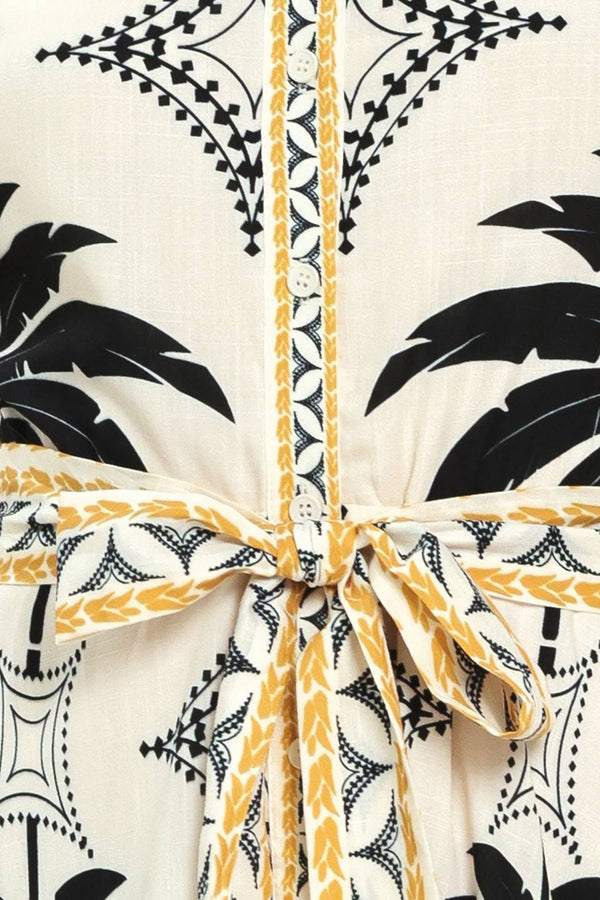 Close up of a black and white palm patterned shirt midi dress with short sleeve and self sash tie | Flying Tomato