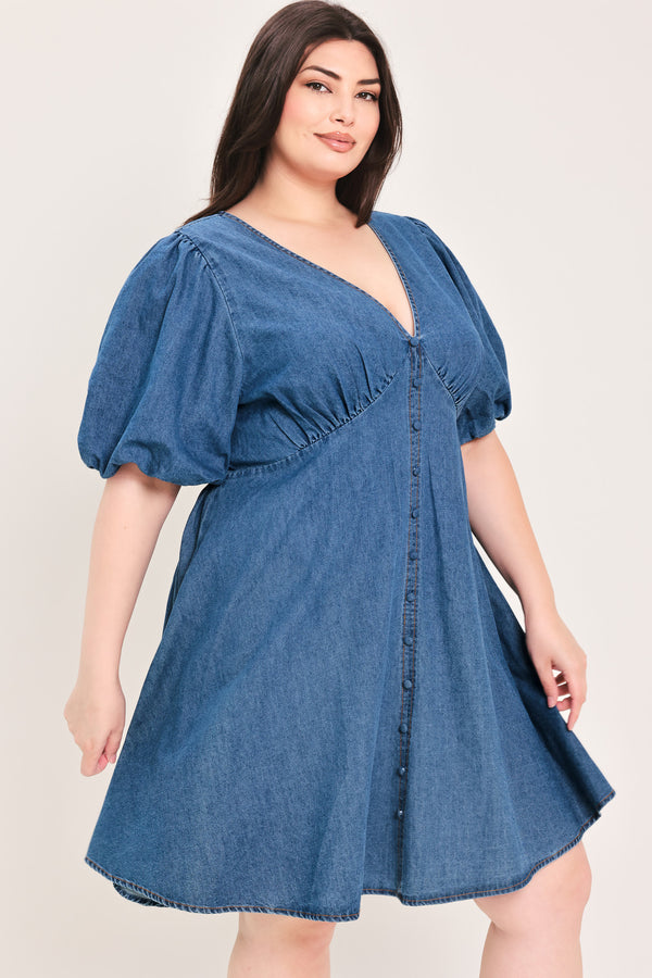 Woman wearing a denim mini dress featuring V neckline, short puff sleeve, button down detail, circle skirt and back zipper closure | Flying Tomato