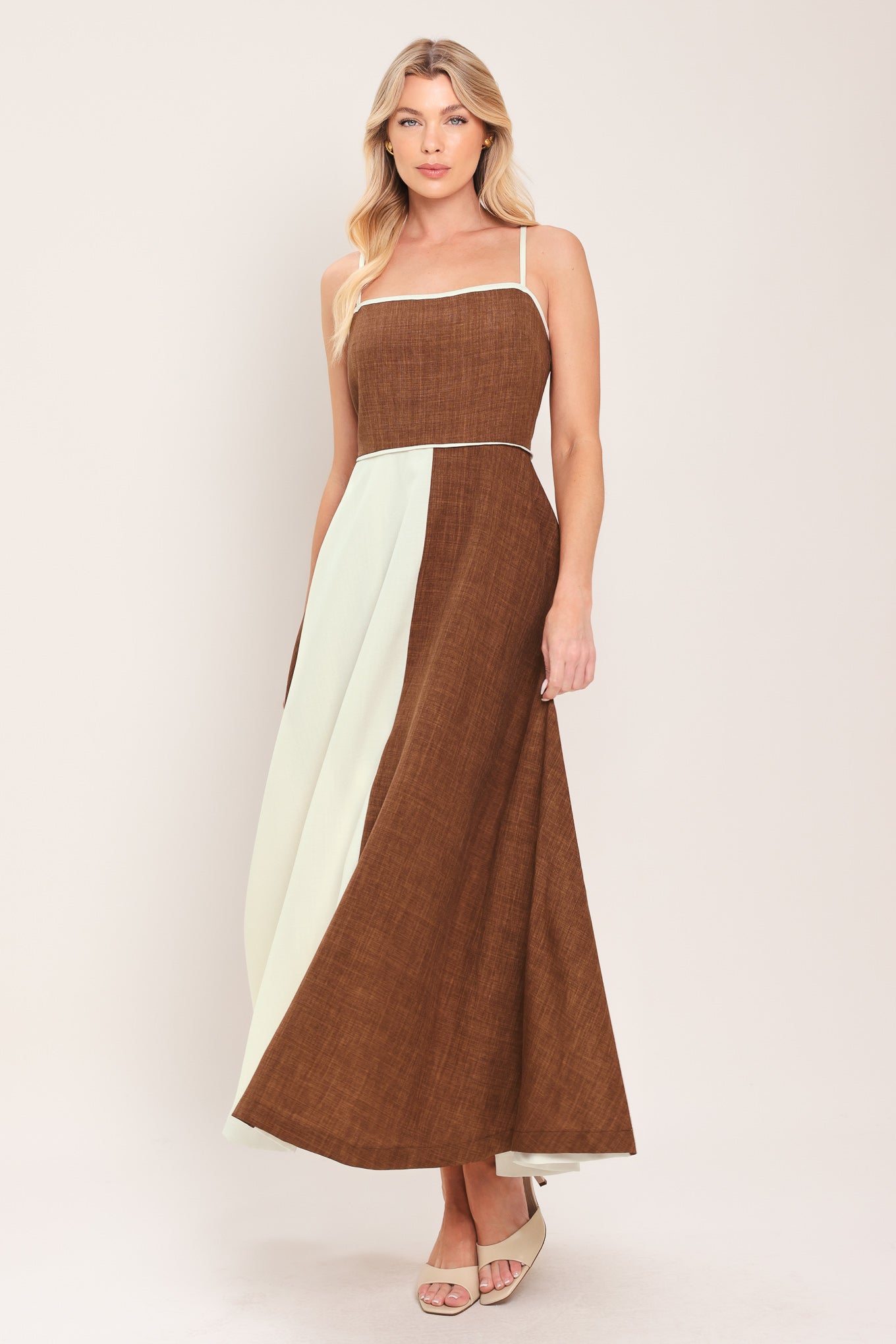 Woman wearing a two-tone dress with brown and white colors | Flying Tomato